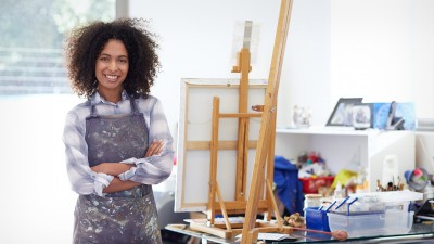 Woman in the online master of art education standing in art studio