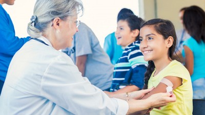 Ohio School Nurse working with young child