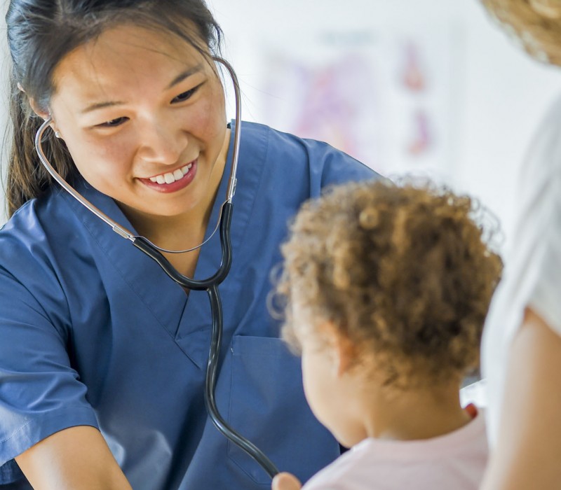 A nursing student in the Primary Care Certificate program interacts with a patient.